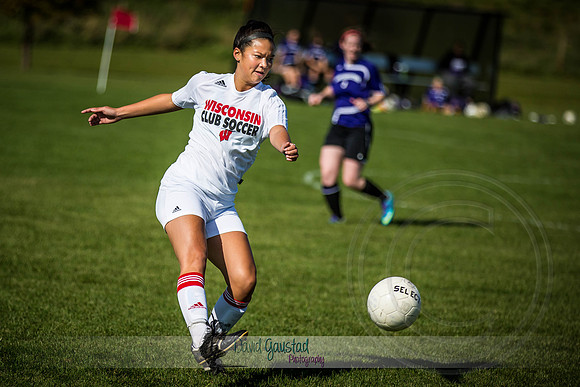 Picture of UW Madison Women's Club Soccer player kicking the ball