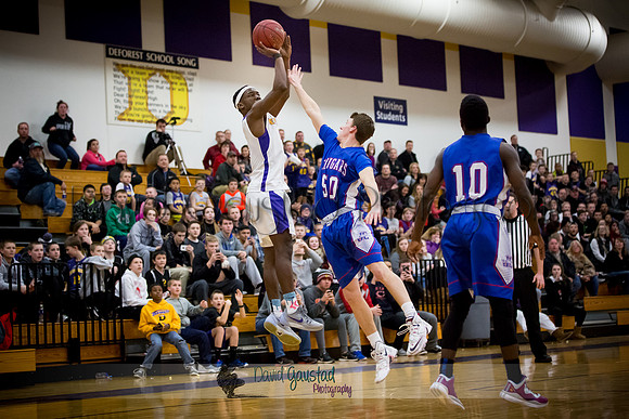 Corian Davis takes a shot at DeForest Boys Basketball vs Janesville Craig February 2016